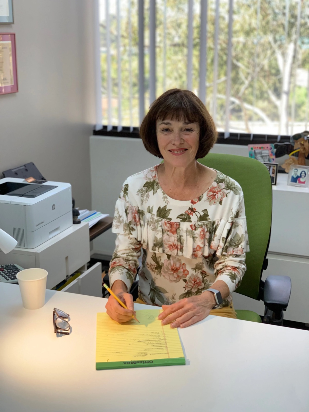 Mom at her desk, mid-list